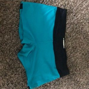 Teal and black gym shorts
